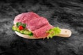 Fresh raw pork ham meat decorated with vegetables on kitchen table plus clipping path Royalty Free Stock Photo