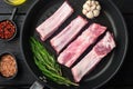 Fresh raw pork meat from organic farm with spices, in cast iron frying pan, top view flat lay Royalty Free Stock Photo
