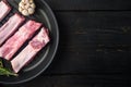 Fresh raw pork meat from organic farm with spices, in cast iron frying pan, top view flat lay Royalty Free Stock Photo