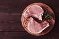 Fresh, raw pork meat, sliced, on a cutting board, with spices, horizontal, rustic style, toning Royalty Free Stock Photo