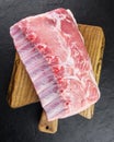 Fresh raw pork piece on wooden board Royalty Free Stock Photo