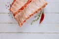 Fresh raw pork ribs with marinade ingredients on white wood background Royalty Free Stock Photo