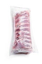 Fresh raw pork ribs in a vacuum package isolated on white Royalty Free Stock Photo