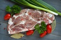 Fresh raw pork shoulder chop with spices and vegetables Royalty Free Stock Photo