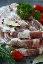 Fresh raw pork shoulder chop with spices and vegetables Royalty Free Stock Photo