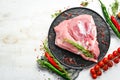 Fresh raw pork shoulder with ingredients and spices on kitchen background. Meat. Top view. Rustic style Royalty Free Stock Photo