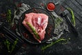 Fresh raw pork shoulder with ingredients and spices on kitchen background. Meat. Top view. Rustic style Royalty Free Stock Photo