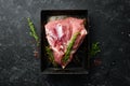 Fresh raw pork shoulder with ingredients and spices on kitchen background. Meat. Top view. Rustic style Royalty Free Stock Photo