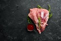 Fresh raw pork shoulder with ingredients and spices on kitchen background. Meat. Top view. Rustic style Royalty Free Stock Photo