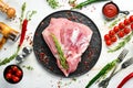 Fresh raw pork shoulder with ingredients and spices on kitchen background. Meat. Top view. Rustic style Royalty Free Stock Photo