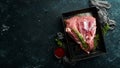 Fresh raw pork shoulder with ingredients and spices on kitchen background. Meat. Top view. Rustic style Royalty Free Stock Photo