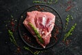 Fresh raw pork shoulder with ingredients and spices on kitchen background. Meat. Top view. Rustic style Royalty Free Stock Photo