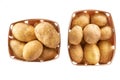 fresh raw potatoes in a wooden box isolated on white background, top view