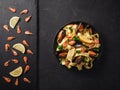 Fresh raw prawns or boiled red shrimps with spices and lemon on slate stone on dark stone background. Seafood, top view, flat lay Royalty Free Stock Photo