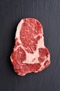 Fresh raw Prime Black Angus beef steak on stone background Royalty Free Stock Photo