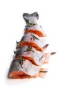 Fresh raw rainbow trout fish cut into slices with rosemary isolated on white Royalty Free Stock Photo