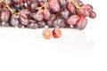 Fresh raw red wine grapes isolated on white Royalty Free Stock Photo