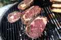 Closeup of a beef steak on the grill. Shallow depth of field Royalty Free Stock Photo