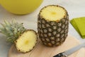 Fresh raw ripe tropical pineapple on a cuttingboard