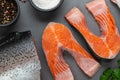 Fresh raw salmon cooking. Fish steak with herbs and spices Royalty Free Stock Photo