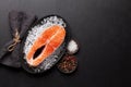 Fresh raw salmon cooking. Fish steak with herbs and spices Royalty Free Stock Photo