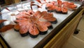 Fresh raw salmon fillet on ice on the counter in a fish store. red fish fillets in the glass refrigerator is sold in the Royalty Free Stock Photo