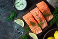 Fresh raw salmon fish fillet with cooking ingredients, herbs and lemon. Generative AI