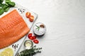 Fresh raw salmon and ingredients for marinade on white wooden table, flat lay. Space for text Royalty Free Stock Photo