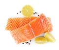 Fresh raw salmon with pepper, lime and lemon on background, top view. Fish delicacy