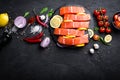 Fresh raw salmon red fish fillet on black background Royalty Free Stock Photo