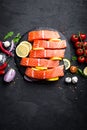 Fresh raw salmon red fish fillet on black background Royalty Free Stock Photo