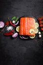 Fresh raw salmon red fish fillet on black background Royalty Free Stock Photo