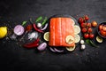 Fresh raw salmon red fish fillet on black background Royalty Free Stock Photo