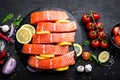 Fresh raw salmon red fish fillet on black background Royalty Free Stock Photo