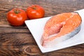 Fresh raw salmon red fish steak with herbs and vegetables Royalty Free Stock Photo