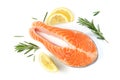 Salmon steak on a white background with lemon and spices Royalty Free Stock Photo