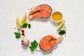 Fresh raw salmon steak, olive oil, lemon and spices are arranged Royalty Free Stock Photo