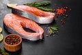 Fresh raw salmon steak with spices and herbs prepared for grilled baking Royalty Free Stock Photo