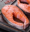 Fresh raw salmon steak with spices and herbs prepared for grilled baking Royalty Free Stock Photo