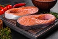 Fresh raw salmon steak with spices and herbs prepared for grilled baking Royalty Free Stock Photo