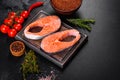 Fresh raw salmon steak with spices and herbs prepared for grilled baking Royalty Free Stock Photo