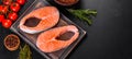 Fresh raw salmon steak with spices and herbs prepared for grilled baking Royalty Free Stock Photo