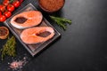 Fresh raw salmon steak with spices and herbs prepared for grilled baking Royalty Free Stock Photo