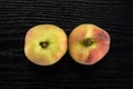 Fresh raw saturn peach on black wood Royalty Free Stock Photo