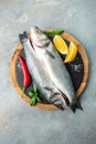 Fresh raw sea bass on light background. vertical image. top view. place for text Royalty Free Stock Photo