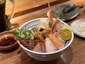 Fresh raw seafood mixed rice bowl. Kaisen-Don. Japanese rice with sashimi of shrimp, tuna, Otoro, salmon, sea urchin, Engawa Royalty Free Stock Photo