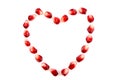 Fresh raw seeds of pomegranate fruit with heart symbol isolated on white background, Heart symbol made from seeds of pomegranate Royalty Free Stock Photo