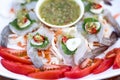 Fresh raw shrimp in fish sauce on white plated thai seafood background Royalty Free Stock Photo