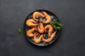 Fresh raw shrimp with ice on a black stone background. Seafood Royalty Free Stock Photo