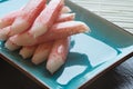 Fresh raw sushi crabsticks on plate with chopsticks Royalty Free Stock Photo